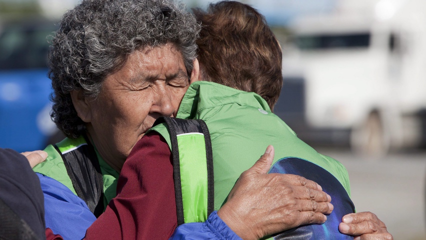 Annie Gordon, 76, a survivor of residential schools, shares an emotional moment at the opening ceremonies of the Truth and Reconciliation Commission for residential school survivors in Inuvik, N.W.T., earlier this week. Photo by James Mackenzie, Canadian Press.