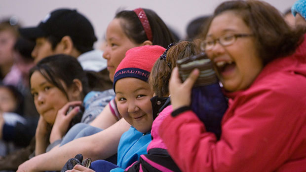 A group of children laugh at Maani Ulujuk school in Rankin Inlet, Nunavut, during a governor general's visit in 2009. According to 2011 census data, 32.5 per cent of Nunavut's population is under the age of 15. (Sean Kilpatrick/ Canadian Press )