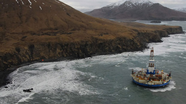 The conical drilling unit Kulluk, sitting grounded 60 kilometres southwest of Kodiak City, Alaska. This week, Shell announced it was halting Arctic drilling in 2013.  (U.S. Coast Guard, Petty Officer 2nd Class Zachary Painter/Associated Press )
