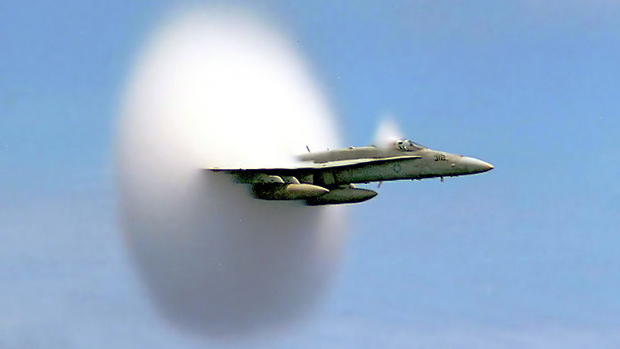 A U.S. military aircraft breaks the sound barrier in the skies over the Pacific Ocean. (John Gay/ Wikimedia Commons)