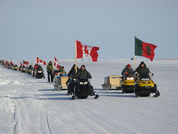 Defence Minister Peter McKay and Chief of Defence Staff Gen. Walter Natynczyk lead a parade of Canadian Rangers and regular-forcde soldiers up the runway of this remote military post on the northern tip of Ellesmere Island at the close of Operation Nunalivut, the latest military mission intended to reinforce Canada's control of the North. The operation included the participation of a Danish military sled dog team, the first time foreign personnel have taken part in such an operation. THE CANADIAN PRESS/Bob Weber