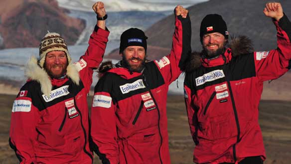 Devon McDiarmid, left, Adrian Hayes, middle, and Derek Crowe at the finish point of their Greenland kite-ski expedition on July 25, 2009. The trio recently learned their trek has set a Guinness World Record. (Emirates NBD Greenland Quest)