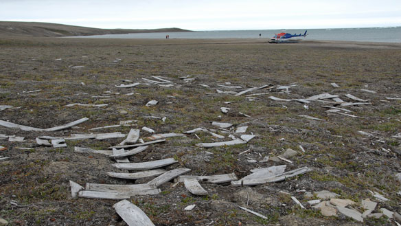 These wooden barrel pieces are from HMS Investigator's cache on Banks Island. A Parks Canada archeology team found three graves, about 60 metres from the cache site, on Monday. (University of Western Ontario)