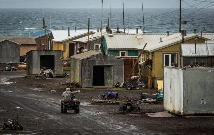 A boy plays with a toy gun in Savoonga, Alaska. August 30, 2012. Photo: Loren Holmes. Alaska Dispatch. 