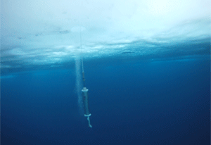 Water appears clear and blue in parts of the Arctic ocean that can't sustain phytoplankton. In this screenshot from a video shot in the Chukchi Sea, a research instrument is seen being tugged up to the surface. (Gert van Dijken)