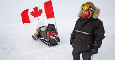 Canadian Ranger Joe Amarualik from Iqaluit stands beside his snowmobile during a sovereignty patrol near Eureka on Ellesmere Island, Nunavut, in 2007. Researchers will set up a world-class astronomical observatory on the island, which has some of the best sky gazing conditions in the world. (Jeff McIntosh/The Canadian Press)