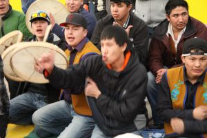 Hand game players use elaborate hand gestures to confuse the opponents and to call the play. Photo by Levon Sevunts