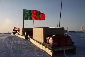 A Ranger and a Canadian flags fly on Inuit sleds loaded for an Arctic sovereignty patrol in the vicinity of the Canadian Forces Station Alert. Photo by Levon Sevunts.