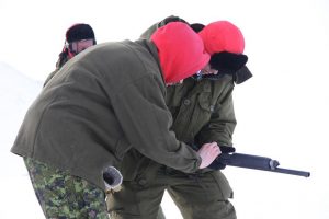 A Canadian Forces soldier learns how to use a shotgun. Photo by Levon Sevunts.