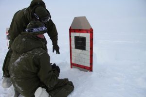 A Canadian soldier discusses his shots with a colleague. Photo by Levon Sevunts.