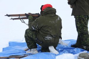 An Australian officer on an exchange program with Canadian Forces fires his Lee Enfield rifle. Photo by Levon Sevunts.