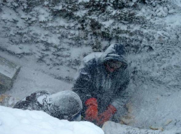 Crewmembers in Unalakleet work to thaw out sections of pipe from the main water line, which froze solid in March 2013. Residents have so far been without running drinking water for almost a month. (Courtesy Scott Dickens/ Alaska Dispatch)