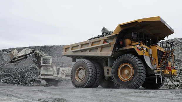 Miners work in the open pit mine at Agnico-Eagle's Meadowbank site in August 2011. The mine is situated 75 km north of Baker Lake, Nunavut. (The Canadian Press)
