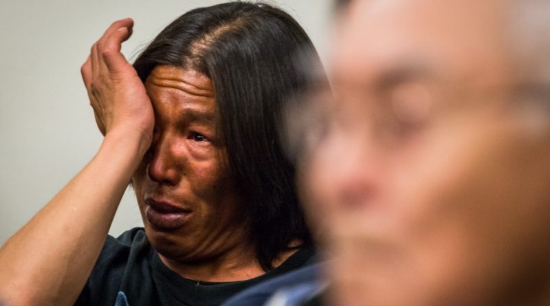 A defendant wipes away tears after listening to testimony by elder Noah Okoviak. Both were cited after defying an emergency closure last summer. May 20, 2013. (Loren Holmes / Alaska Dispatch)