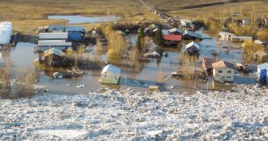 Homes and other buildings are shown flooded in Galena, Alaska. (Ed Plumb, National Weather Service, AP)
