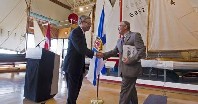 Premier Darrell Dexter, right, and Natural Resources Minister Joe Oliver shake hands at a news conference at the Maritime Museum of the Atlantic in Halifax on Tuesday, June 18, 2013. Oliver announced that Ottawa is raising the liability cap for companies operating in Atlantic Canada's offshore to one billion dollars under new proposed legislation. (Andrew Vaughan / The Canadian Press)