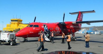 Passengers exit an Air Greenland Dash 8 after arrival at the Iqaluit airport from Nuuk last summer. This year's first flight of the year was cancelled, possibly due to lack of demand. (Daniel MacIsaac/CBC)