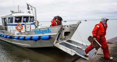 Workers disembark from a Shell Oil / Olgoonik Corporation oil spill response vessel, after a training exercise. August 30, 2012. (Loren Holmes, Alaska Dispatch)