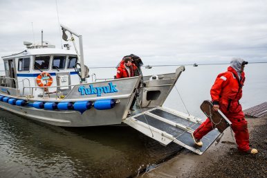 Workers disembark from a Shell Oil / Olgoonik Corporation oil spill response vessel, after a training exercise. August 30, 2012. (Loren Holmes, Alaska Dispatch)