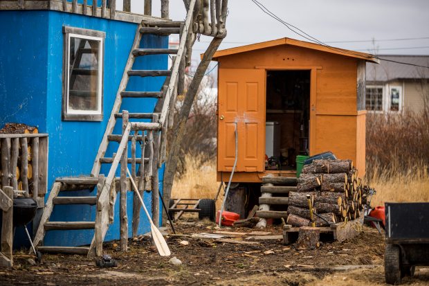 Firewood cut and stacked outside a Bethel home (May 22, 2013). Bethel community leaders are searching for creative ways to solve a housing shortage, and long-term plans are in the works. But short-term needs are real in the Southwest Alaska regional hub. (Loren Holmes / Alaska Dispatch)