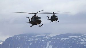 Two Royal Canadian Air Force helicopters fly near Arctic Bay, Nunavut, on Wednesday. The aircraft arrived in the area to rescue hunters and tourists stranded by drifting ice. (Photo courtesy of Niore Iqalukjuak)