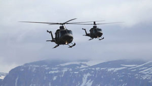 Two Royal Canadian Air Force helicopters fly near Arctic Bay, Nunavut, on Wednesday. The aircraft arrived in the area to rescue hunters and tourists stranded by drifting ice. (Photo courtesy of Niore Iqalukjuak)