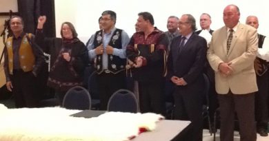 The group of aboriginal leaders and federal and territorial leaders shortly before signing the deal in Inuvik, N.W.T., on Tuesday evening. (Desmond Loreen / CBC)