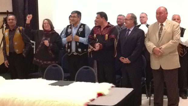 The group of aboriginal leaders and federal and territorial leaders shortly before signing the deal in Inuvik, N.W.T., on Tuesday evening. (Desmond Loreen / CBC)