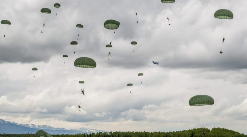 Soldiers from the Army's 4th Brigade, 25th Infantry Division participate in operation Spartan Reach at JBER's Malemute Drop Zone on June 4, 2013. The operation is designed to simulate parachuting behind enemy lines and securing a hostile airfield. (Loren Holmes, Alaska Dispatch)