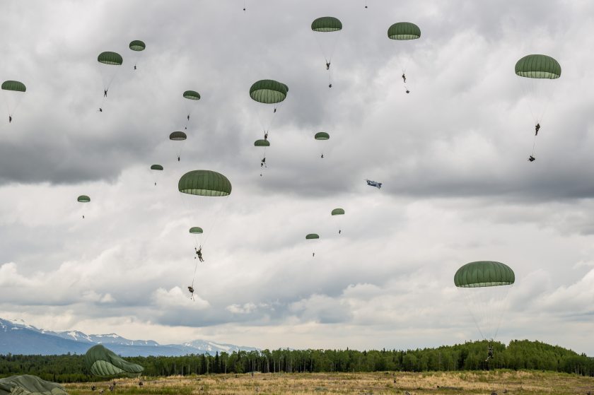 Soldiers from the Army's 4th Brigade, 25th Infantry Division participate in operation Spartan Reach at JBER's Malemute Drop Zone on June 4, 2013. The operation is designed to simulate parachuting behind enemy lines and securing a hostile airfield. (Loren Holmes, Alaska Dispatch)