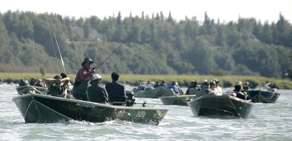 Fishermen crowd together as they jostle for position on the Kenai River in Kenai, Alaska in this 2005 file photo. (Al Grillo / AP Photo)