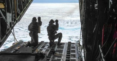 Petty Officer 3rd Class Jesse Sanchez and Petty Officer 3rd Class Nathan Matthews, prepare to deploy sensors from a Hercules airplane in the Alaskan Arctic. (Sara Mooers / USCG / Alaska Dispatch )