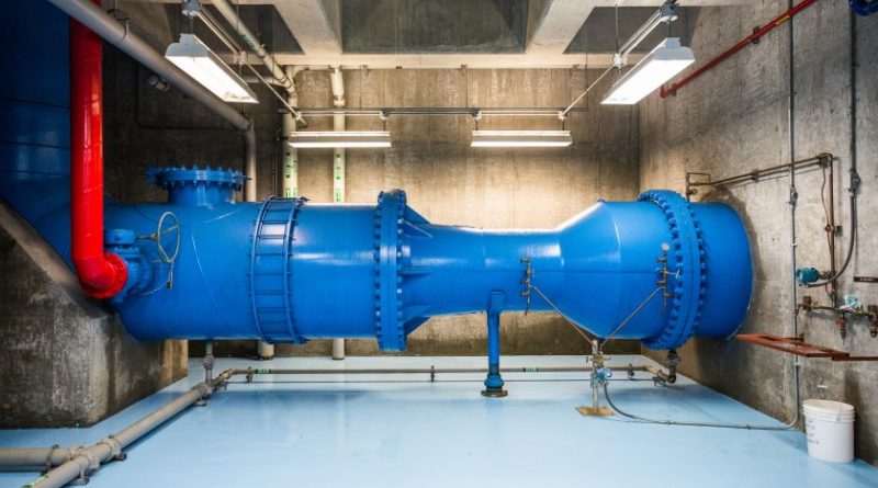 The Eklutna Water Treatment Facility provides the majority of Anchorage's drinking water, up to 35 million gallons per day. Because of the high quality water it receives from Eklutna lake, minimal treatment is required. Here, untreated water enters the facility in a 54 inch pipe. July 30, 2013. (Loren Holmes / Alaska Dispatch)