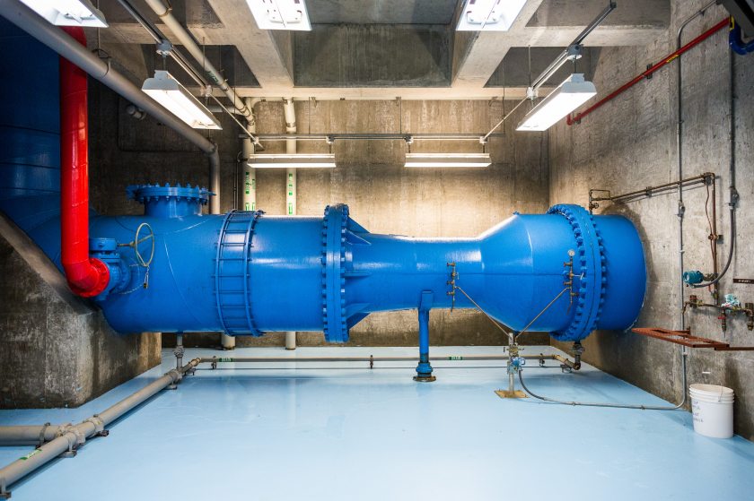 The Eklutna Water Treatment Facility provides the majority of Anchorage's drinking water, up to 35 million gallons per day. Because of the high quality water it receives from Eklutna lake, minimal treatment is required. Here, untreated water enters the facility in a 54 inch pipe. July 30, 2013. (Loren Holmes / Alaska Dispatch)