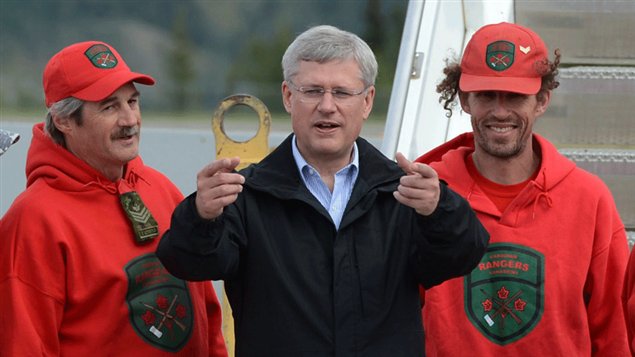 Prime Minister Stephen Harper is greeted by a group of northern patrollers as he arrives in Whitehorse, Yukon, for the first stop on his annual northern Canada tour. Photo Credit: Sean Kilpatrick/Canadian Press