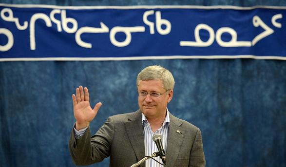 Prime Minister Stephen Harper delivers remarks at a community feast in Rankin Inlet, Nunavut on Wednesday, August 21, 2013. (Sean Kilpatrick / The Canadian Press)