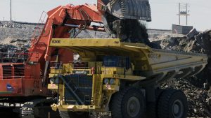 A excavator loads over burden rock into a heavy hauler at the Diavik diamond mine at Lac de Gras, approximately 300 km north east of Yellowknife. (Adrian Wyld/Canadian Press)