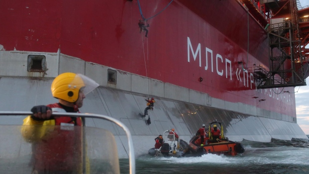 This image made available by Greenpeace shows five activists attempting to climb the Prirazlomnaya, an oil platform operated by Russian state-owned energy giant Gazprom, in the Pechora Sea last Wednesday. The environmental groups said Tuesday two Canadians detained by Russian authorities following the incident have been visited by Canadian diplomats. (Denis Sinyakov, Greenpeace/Associated Press)