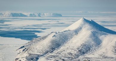 The radar station Tin City, in the foreground, looks across the Bering Stait to the Diomede islands, and beyond them, Chukota, Russia. This is the narrowest point of the Bering Strait, and an increasingly important shipping corridor. (Loren Holmes / Alaska Dispatch)