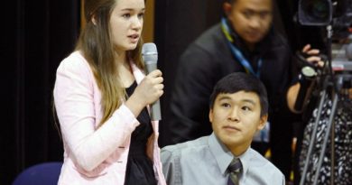 Katherine Dolma answers a question following a Supreme Court LIVE hearing at Barrow High School. Dolma and Nelson Kanuk, seated, are two of the six young plaintiffs in the case. (Jeff Seifert, KBRW – Barrow)