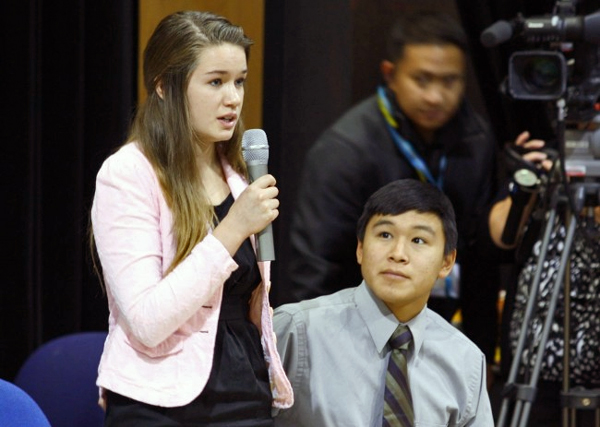 Katherine Dolma answers a question following a Supreme Court LIVE hearing at Barrow High School. Dolma and Nelson Kanuk, seated, are two of the six young plaintiffs in the case. (Jeff Seifert, KBRW – Barrow)