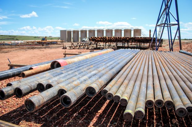 A glut of oil in the Lower 48 has analysts increasingly predicting that oil prices could drop in the months to come. But if it lasted long, such a decline would be problematic for Alaska, where the government budget largely depends on oil production and where one third of all jobs depend on money generated in its oil patch. Pictured are pipes at an oil drillsite in Williston, North Dakota, 2011. Lindsey Gira / cc via flickr