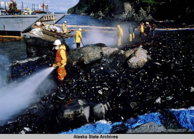 Spill workers hose a beach down after a Corexit oil dispersant test in the wake of the Exxon Valdez spill. (Courtesy Alaska State Archives / Alaska Dispatch)