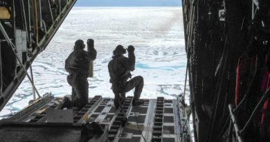 Petty Officer 3rd Class Jesse Sanchez and Petty Officer 3rd Class Nathan Matthews, both aviation maintenance technicians, prepare to deploy two of six sensors from an Air Station Kodiak HC-130 Hercules airplane north of Barrow, Alaska. The sensors gather data about the Arctic Ocean as they descend through the water column. They are deployed through a partnership between the U.S. Coast Guard and the University of Washington's Polar Science Center. July 16, 2013 (Sara Mooers / USCG/ Alaska Dispatch)