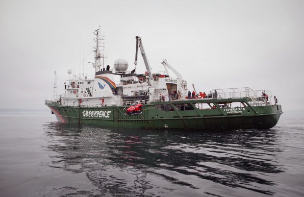 Greenpeace crew launch a two-seater submarine, on loan from the Waitt Insititute, to explore the Chukchi Sea floor near a proposed Shell drill site north of Point Hope, Alaska, in July 2012. (Greenpeace)