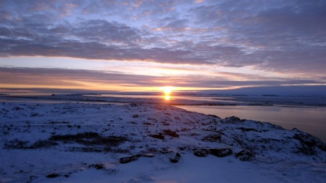 Sunrise in Kugluktuk, Nunavut. The hamlet's emergency siren now sounds at 8:30 a.m. every school day to get the kids out of bed and into class. (Peter Kakolak)