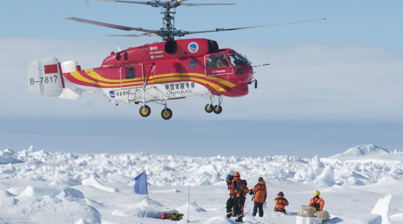 Rescue helicopter from the Chinese ship Xue Long in Antarctica. The helicopter ferried the scientists, tourists and journalists in groups of 12 to an Australian government supply ship, the Aurora Australis. (Jessica Fitzpatrick / Australian Antarctic Division / AFP)