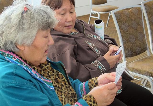 Two Alaska women in Barrow, Alaska singing "I'm Dreaming of My Home" in Inupiaq. (Mark Thiessen / AP)