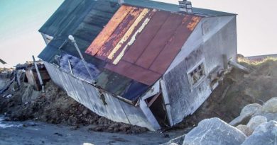 A home in Shishmaref falls into the sea. Shishmaref is highly susceptible to coastal erosion. (Courtesy Tony Weyiouanna / Alaska Dispatch)