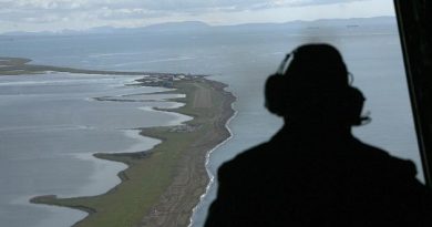 The coast near the village of Kivalina, Alaska. Ships in the upper right wait to be loaded from the Red Dog copper mine. (Al Grillo/AP)